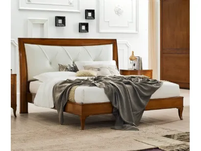 Letto Aurora in legno con testiera in pelle di Le Fablier